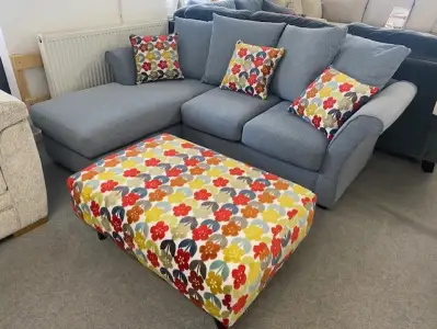 Blue small chaise corner with contrasting footstool