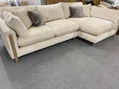 Cream corner sofa with exposed wood